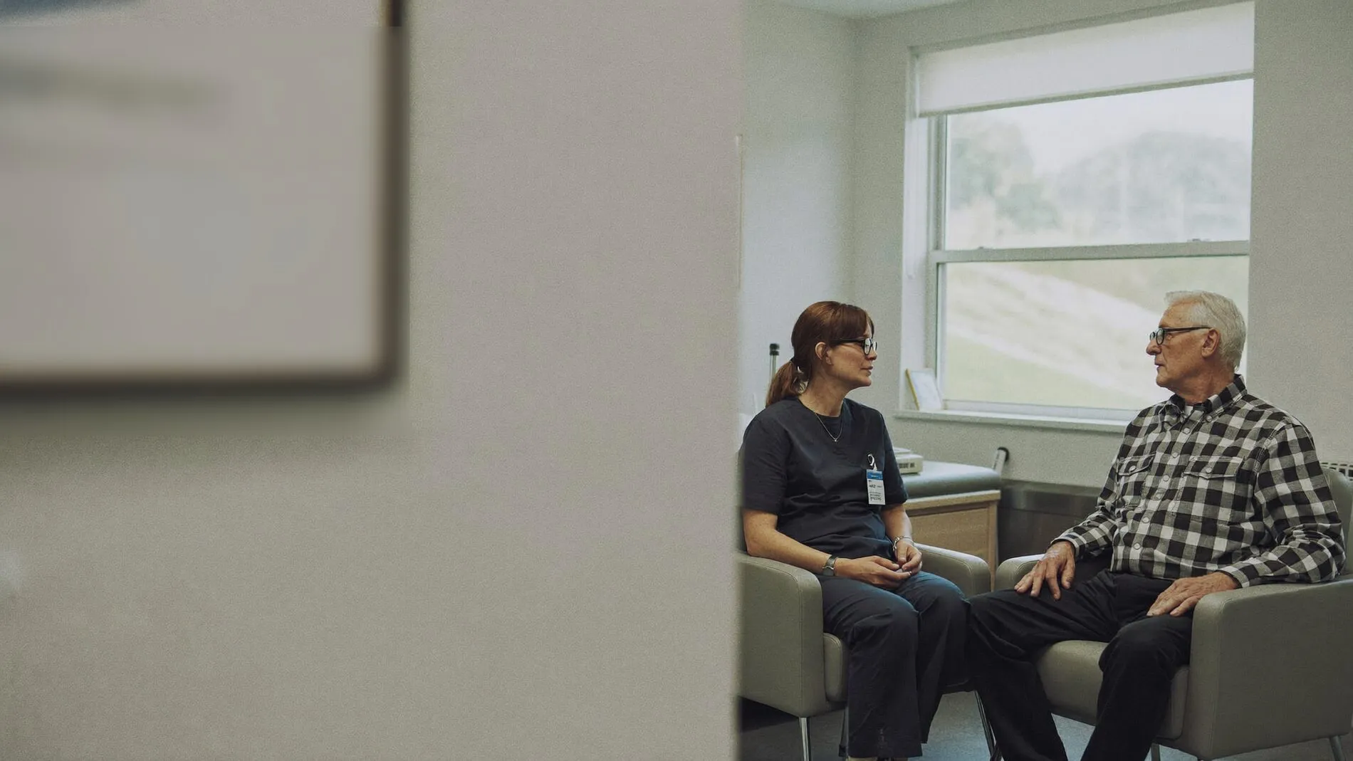 A nurse practitioner talking with a patient at Beaver County Memorial Hospital